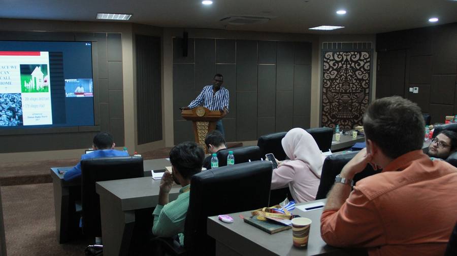 Director presenting at conference